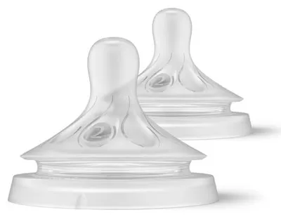 Two clear baby bottle nipples with white bases are shown against a white background.