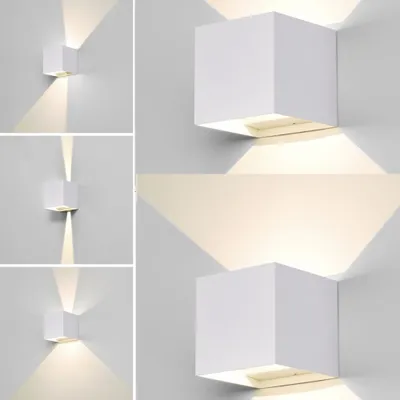 A collage of images showing white cube-shaped wall lights mounted on a white wall, illustrating their light projection patterns.