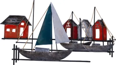 A metal wall decoration depicting a maritime scene with sailboats and houses.