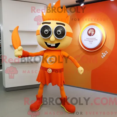 Productafbeelding van Oranje REDBROKOLY messenwerper mascottekostuum gekleed met een dienstjurk en bril
