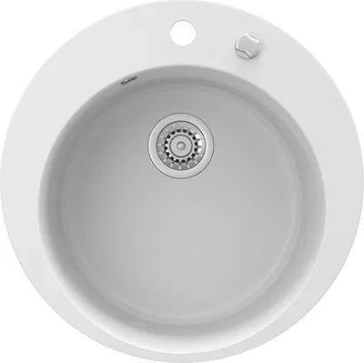 A top-down view of a white, round sink with a silver drain.