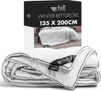 A product shot of a folded winter duvet and its packaging.