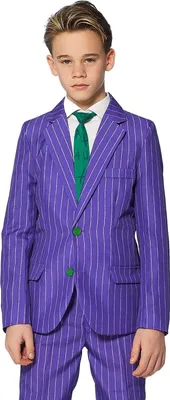 A young boy wearing a purple pinstripe suit with a green tie.