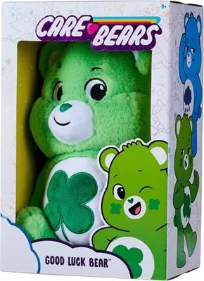 A green Care Bear plush toy in its packaging, with the "Care Bears" logo and text "GOOD LUCK BEAR" visible.