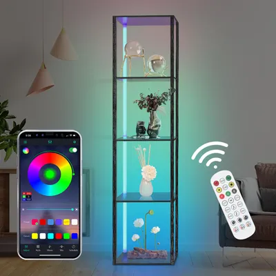 A tall, narrow display cabinet with glass shelves, illuminated by colorful LED lights, is shown in a room setting. A smartphone displaying a color wheel app and a remote control are also visible, suggesting smart control of the lighting.
