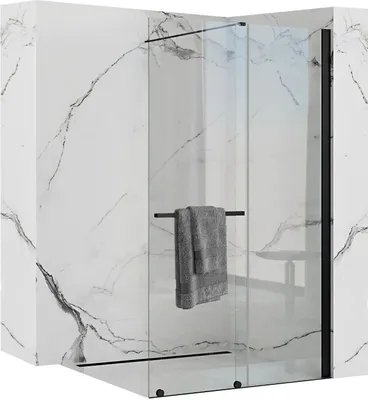 A modern shower enclosure with a marble-effect wall and a towel hanging on a rack.