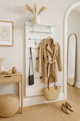 An entryway with a coat rack, console table, and mirror.