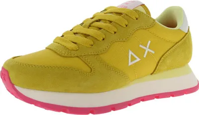 A single yellow sneaker with pink accents is shown from the side against a white background.