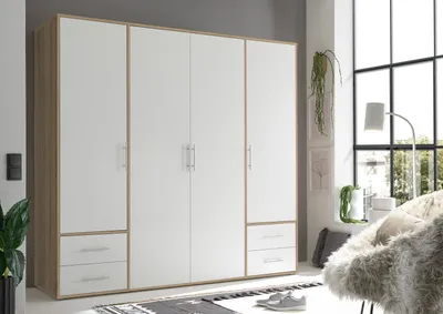 Produktbild von Kleiderschrank "Valencia" in Sonoma Eiche / Weiß mit 4 Schubladen und 4 Türen. Abmessungen (BxHxT) 206x195x60 cm