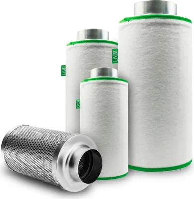 Four air filters of varying sizes are arranged on a white background. One filter is lying on its side in the foreground, while three are standing upright behind it.