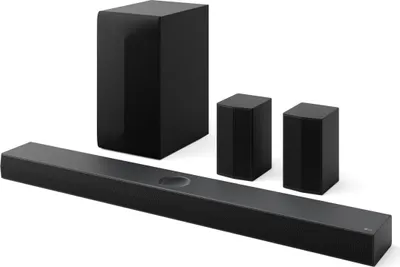 A black LG soundbar system, including a soundbar, subwoofer, and two satellite speakers, is displayed against a white background.