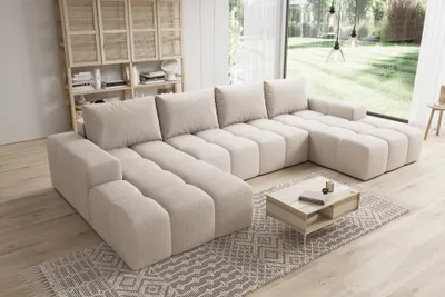 Modern living room with a large sectional sofa in beige.