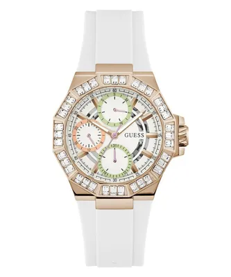 A white and rose gold Guess watch with a white band, set against a white background.