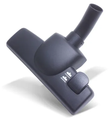 A dark gray vacuum cleaner nozzle is shown against a white background.