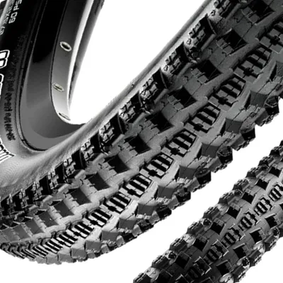 Close-up view of a bicycle tire tread and rim.