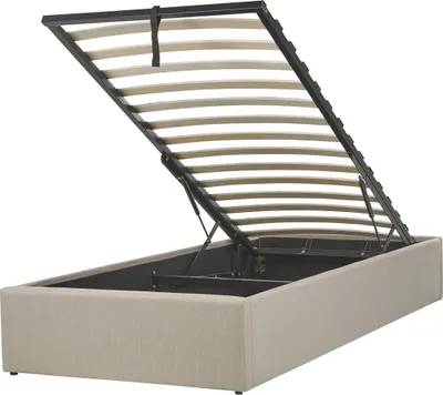 A bed frame with the mattress support lifted, revealing storage space underneath.
