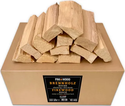 A cardboard box filled with cut pieces of firewood, with a label on the front.