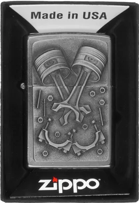 A Zippo lighter with an engine parts design, presented in its packaging.