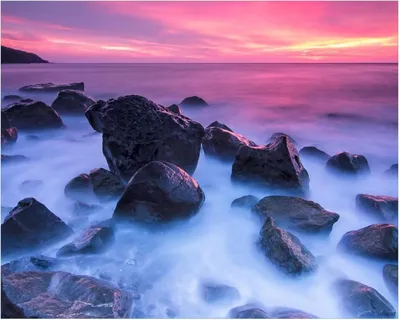 Produktbild von Wallario Poster - Felsen im Meer bei Sonnenuntergang, Kunstdruck Größe: 40 x 50 cm