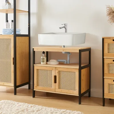 A bathroom vanity with a sink and storage.