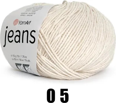 A ball of cream-colored yarn with a label.