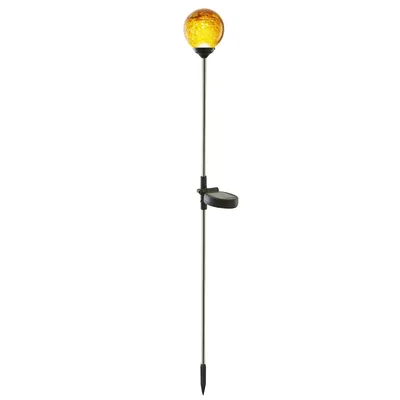 A solar-powered garden light with an orange glass globe.