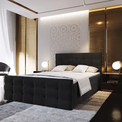 A modern bedroom with a large upholstered bed as the focal point.