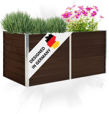 A brown rectangular planter box filled with green plants and pink flowers, with a diagonal banner indicating 'DESIGNED IN GERMANY'.