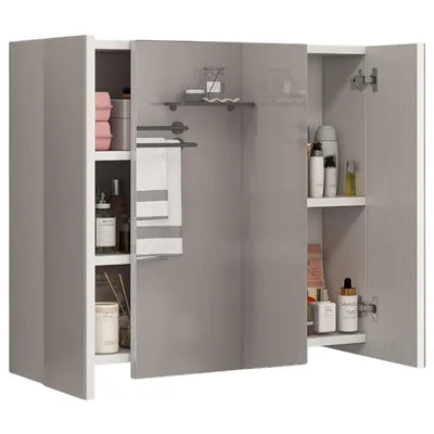 A bathroom cabinet with a three-part mirror and various toiletries and towels inside.