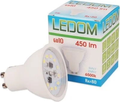 A white LED light bulb and its packaging are shown against a white background.