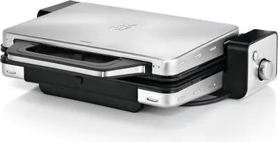 A silver and black electric fondue maker is shown on a white background.