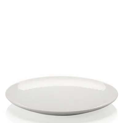A white plate on a white background.