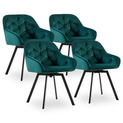 Four green velvet dining chairs are arranged on a white background.
