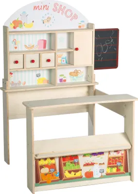 A wooden toy shop counter with shelves and a chalkboard.
