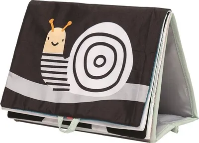A fabric book for babies with a snail design, propped up to stand.