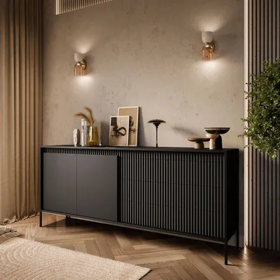 A modern living room with a black sideboard.