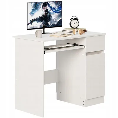 A white computer desk with a monitor, keyboard, and accessories.