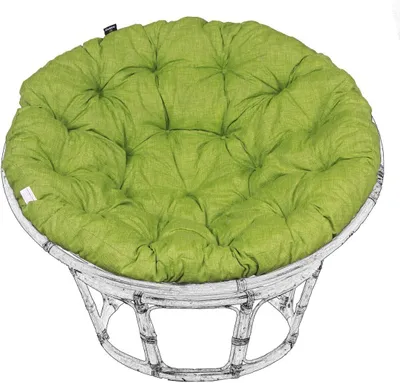 A round green cushion on a white rattan chair.