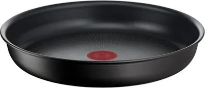 A black frying pan with a red indicator in the center, isolated on a white background.