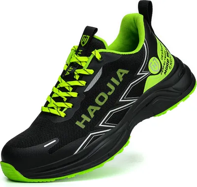 A single black and green athletic shoe is shown against a white background.