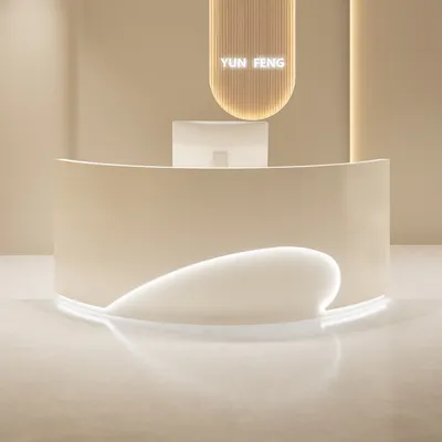 A modern reception desk in a clean, minimalist setting.