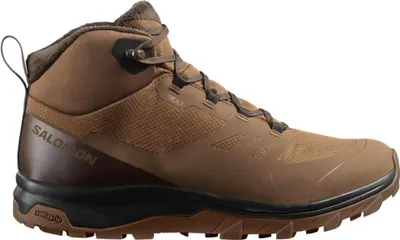A side view of a brown Salomon hiking boot against a white background.