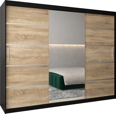 A sliding door wardrobe with mirrored panels, reflecting a bedroom scene with a bed.