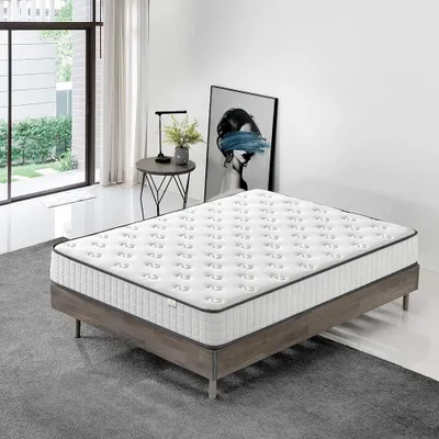 A mattress on a bed frame in a bedroom setting.