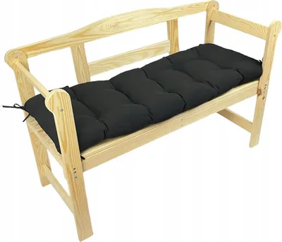 A black cushion on a wooden bench.