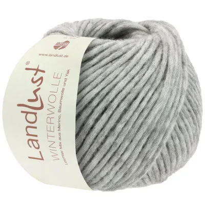 A ball of light gray yarn with a label attached.