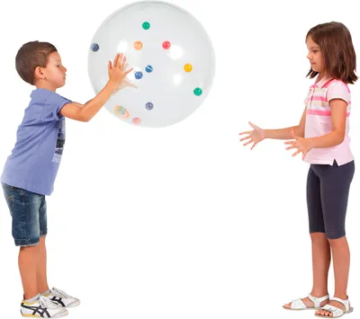 Two children are playing with a large, clear activity ball filled with smaller colorful balls.