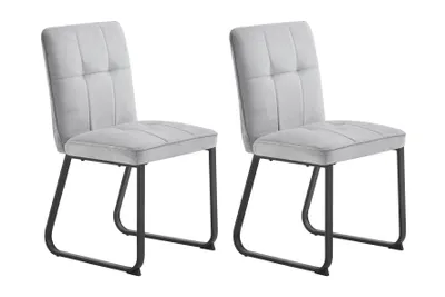 Two light gray upholstered dining chairs with black metal legs are shown against a white background.