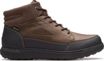A side view of a brown and black men's boot.