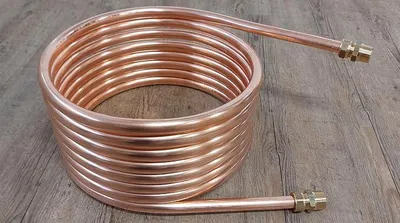 Obrázok produktu pre Špirály z medených trubiek s priemerom 7,5 m, hrúbkou 18 x 1 mm, vonkajším priemerom približne 31 cm. Pripojenie pre ohrev bazéna: 3/4"